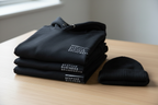 Everyday Brandwear Set stacked lifestyle shot on oak surface with BBB logo
